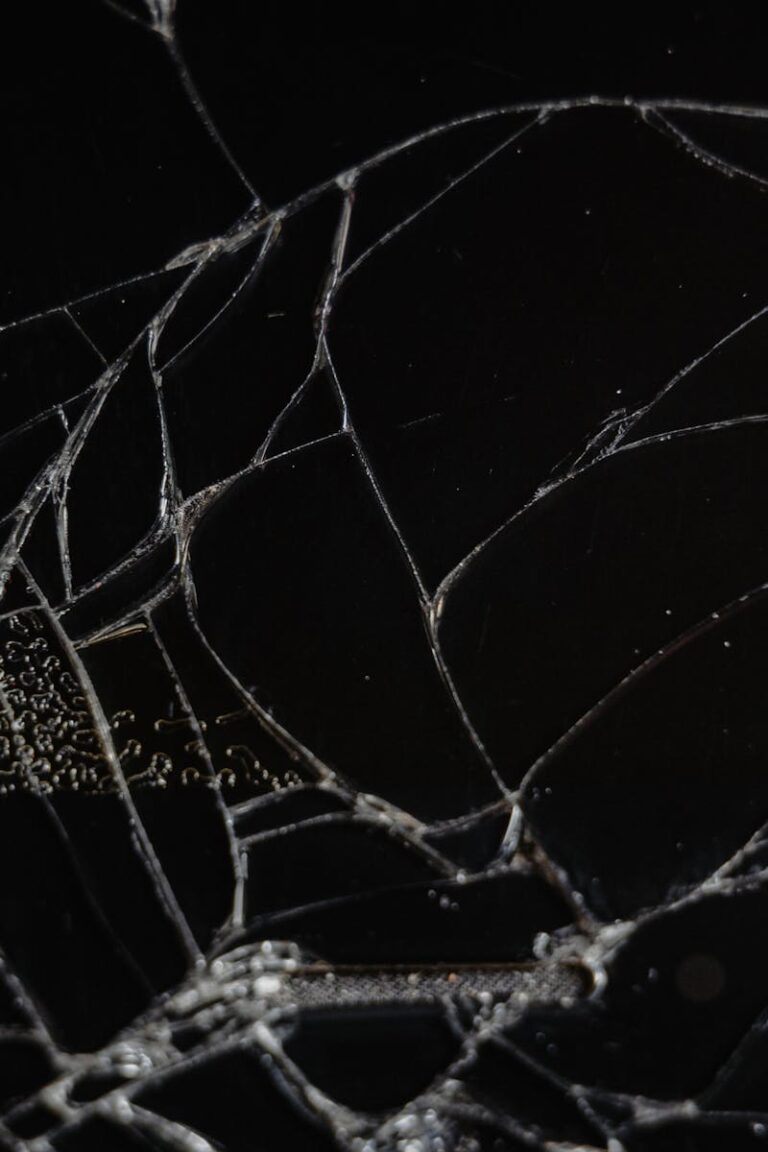 Close-up view of shattered glass showing delicate fragments and patterns.